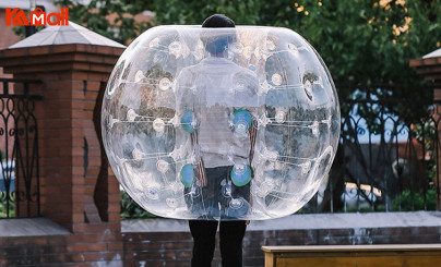 small child zorb ball on grass